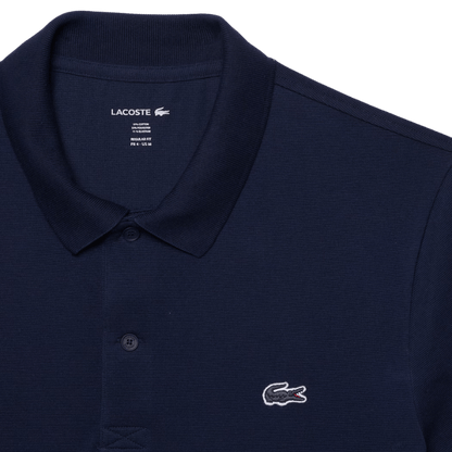 POLO LACOSTE - REGULAR FIT BLEU MARINE - Golf Passion